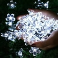 thumbnail image 6 of KOMI Solar Flower Lights,Waterproof 23ft/7M 50LED Peach Blossom Flower Solar Fairy Decorative String Lights for Outdoor Gardens Homes Wedding Christmas Party Lighting Decorations(White), 6 of 9