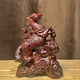 thumbnail image 1 of Ebony wood carving of a horse being promoted to a high rank (or a noble title) - a solid wood craft for home, living room, or office use, suitable as a gift for business or career purposes., 1 of 3