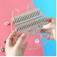 thumbnail image 3 of Piano de pulgar portátil de 17 tonos de cristal transparente con forma de conejo y oso, fácil de transportar, 3 of 4