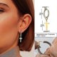 thumbnail image 1 of Pendientes de cruz Huggie Yashi de acero inoxidable dorado sin perforación Diseño italiano, 1 of 2