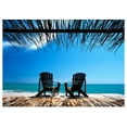 thumbnail image 1 of Great BIG Canvas | Rolled Ian Cumming Poster Print entitled Two Chairs On Deck By Ocean Shaded By Grass Roof; Jamaica, 1 of 4