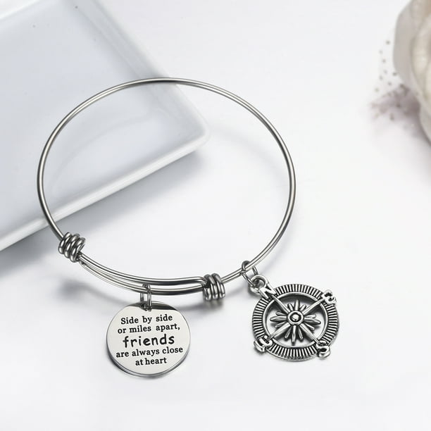 Bangle Bracelets Engraved With Text Side By Side Or Miles Apart in Blade.