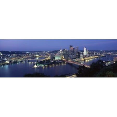 - Buildings along a river lit up at dusk Monongahela River Pittsburgh Allegheny County Pennsylvania USA Poster Print