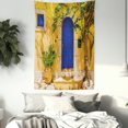 thumbnail image 2 of Yellow and Blue Tapestry, Traditional Greek House Door with Flowers and Tree Mediterranean Scenery, Wall Hanging for Bedroom Living Room Dorm Decor, 60W X 80L Inches, Multicolor, by Ambesonne, 2 of 5
