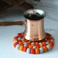 thumbnail image 2 of Hand Crafted Felt Ball Trivets from Nepal Round Chakra, Oranges, 2 of 2