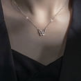 thumbnail image 3 of Delicate Elegance: Bow-Shaped Pendant on a Thin Chain, 3 of 9
