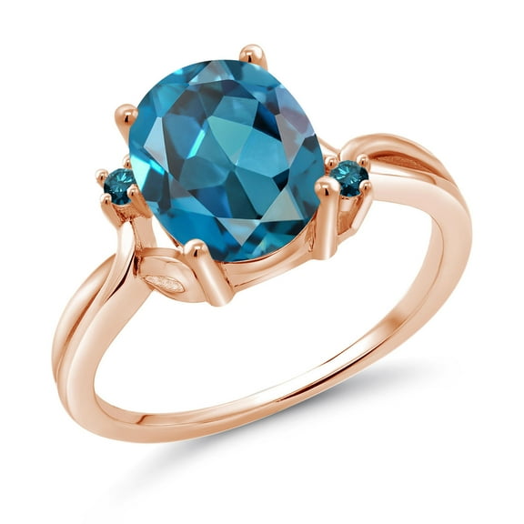 Gem Stone King 18K Rose Gold Plated Silver London Blue Topaz and Blue Diamond 3 Stone Ring for Women (3.03 Cttw, Oval 10X8MM, Gemstone November Birthstone, Size 6)