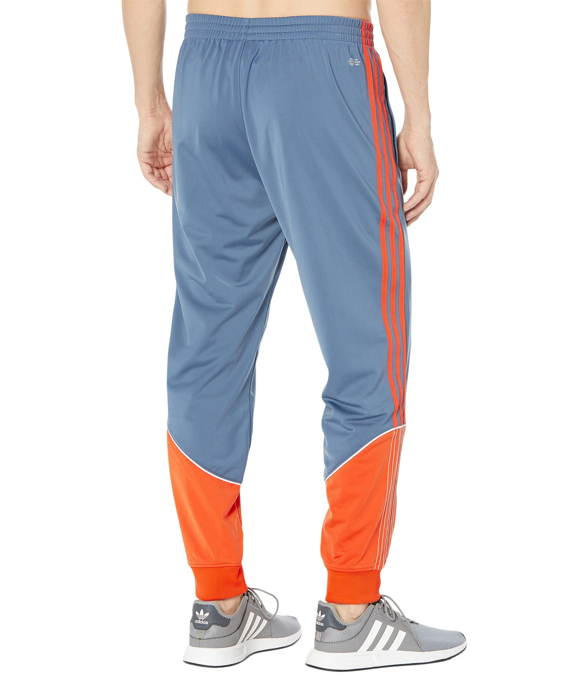 Adidas superstar track pants orange sales