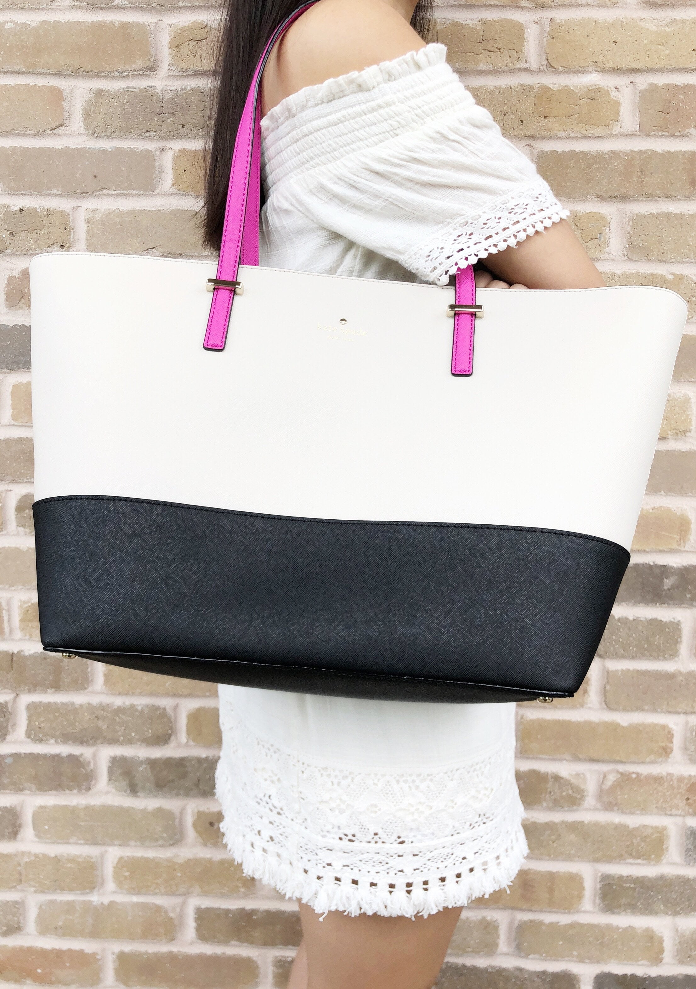 kate spade black tote with pink lining