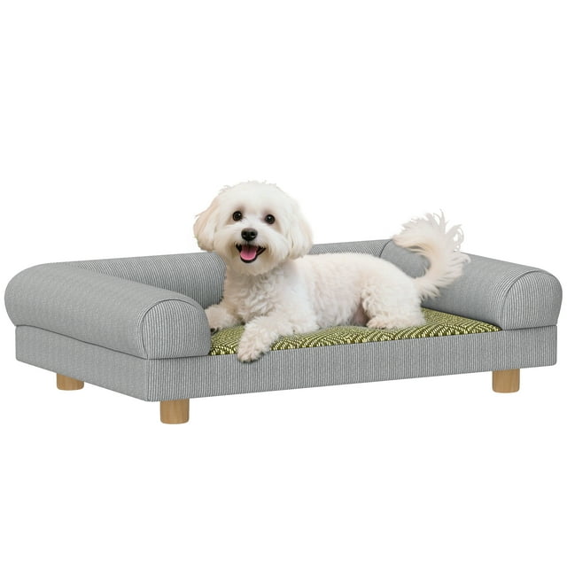 PawHut Pet Sofa, a grey dog couch bed designed for small dogs and indoor kittens, featuring soft corduroy upholstery, supportive armrests, and an elevated design. The sofa measures 24.8 inches wide, 16.1 inches deep, and 6.7 inches high, with a seat size of 17.1 inches by 12.2 inches. Suitable for pets up to 11 lbs and 13.8 inches in length. A white dog is shown lounging on the sofa, highlighting its comfort and style.