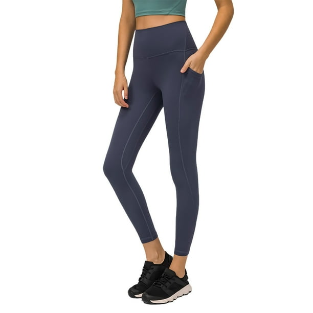 Pantalones de yoga de alto rendimiento con bolsillos laterales: leggings deportivos, nailon y spandex, ajuste ceñido y sujeción.