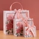 thumbnail image 2 of Bolsa de regalo de cartulina con estampado floral rosa, 3 bolsas de transporte, 2 of 2