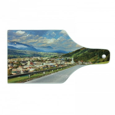 Landscape Cutting Board, Road in the Alps Small Town with Colorful Houses Clouds Clear Sky Rural Scenery, Tempered Glass Cutting and Serving Board, Wine Bottle Shape, Multicolor, by Ambesonne