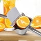 thumbnail image 4 of Exprimidor de limón de acero inoxidable, exprimidor manual de cítricos, lima, naranja, exprimidor de frutas, mango ergonómico resistente, ahorro de mano de obra, prensa de jugo de gran capac, 4 of 5