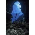 thumbnail image 2 of A diver stops at the entrance to an underwater cave in Grand Cayman  Cayman Islands Poster Print by Brook Peterson/Stock, 2 of 2