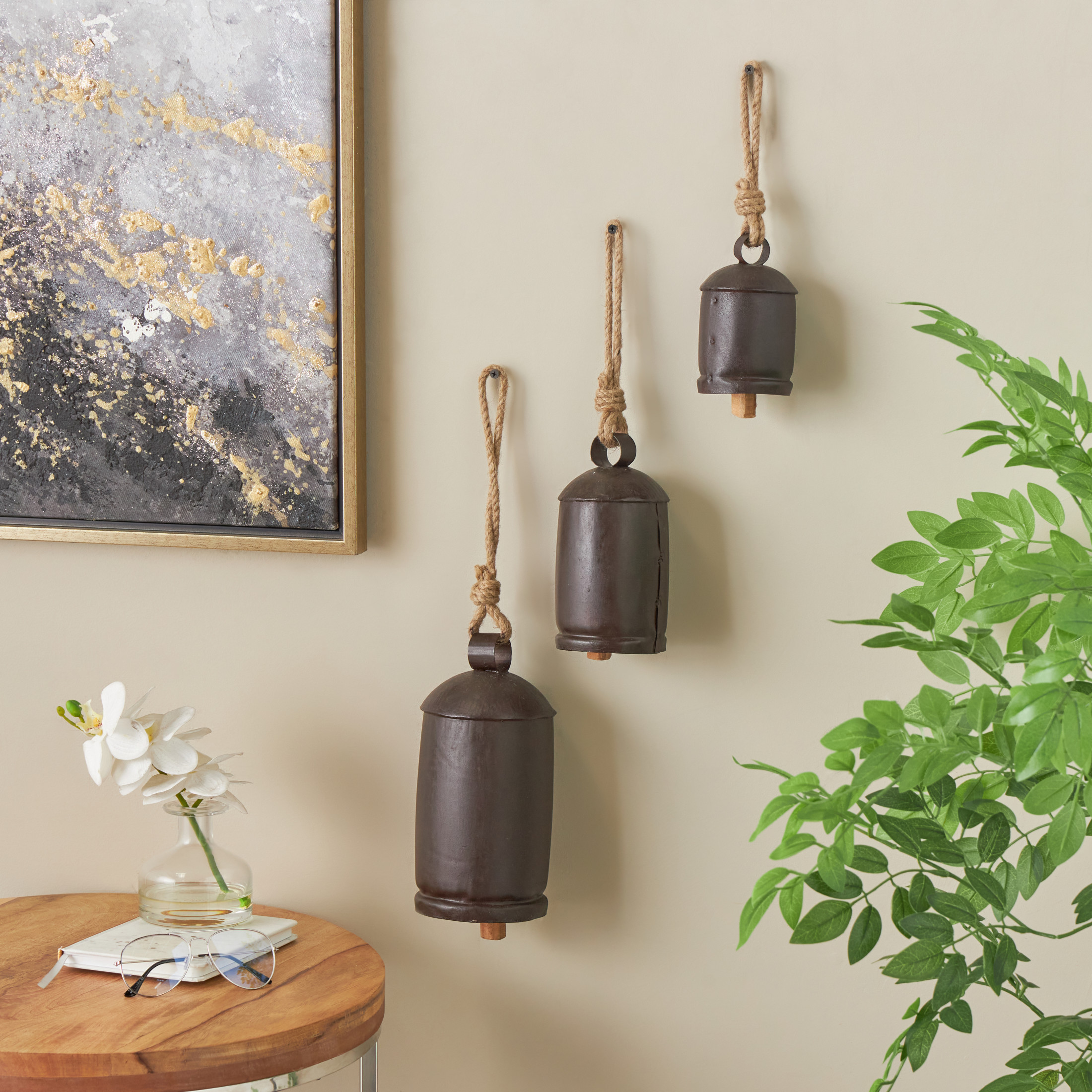 DecMode Tibetan Inspired Dark Brown Metal Cylindrical Decorative Cow Bells with Jute Hanging Rope, 3 Count