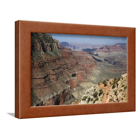 Hikers on the South Kaibab Trail with the Extensive Grand Canyon Vista Extending Beyond Framed Print Wall Art By Garry