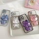 thumbnail image 2 of Funda para iPhone 14 con adorable conejito, soporte oculto, TPU suave transparente, a prueba de golpes, espejo 3D, soporte de conejo con protección para cámara, para mujeres y niñas - Morado, 2 of 8