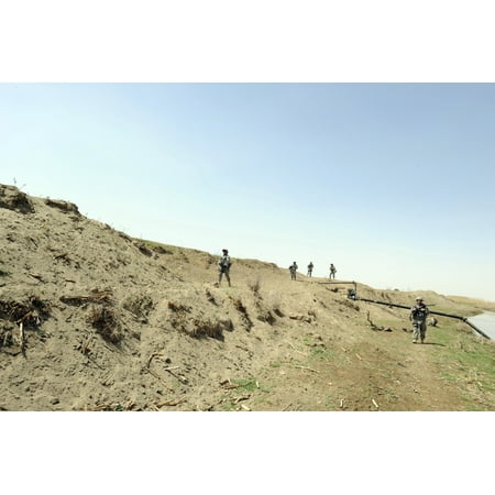 April 9 2009 - US Air Force members conduct a weapons cache sweep along the the Tigris River in support of Operation Iraqi Freedom Poster