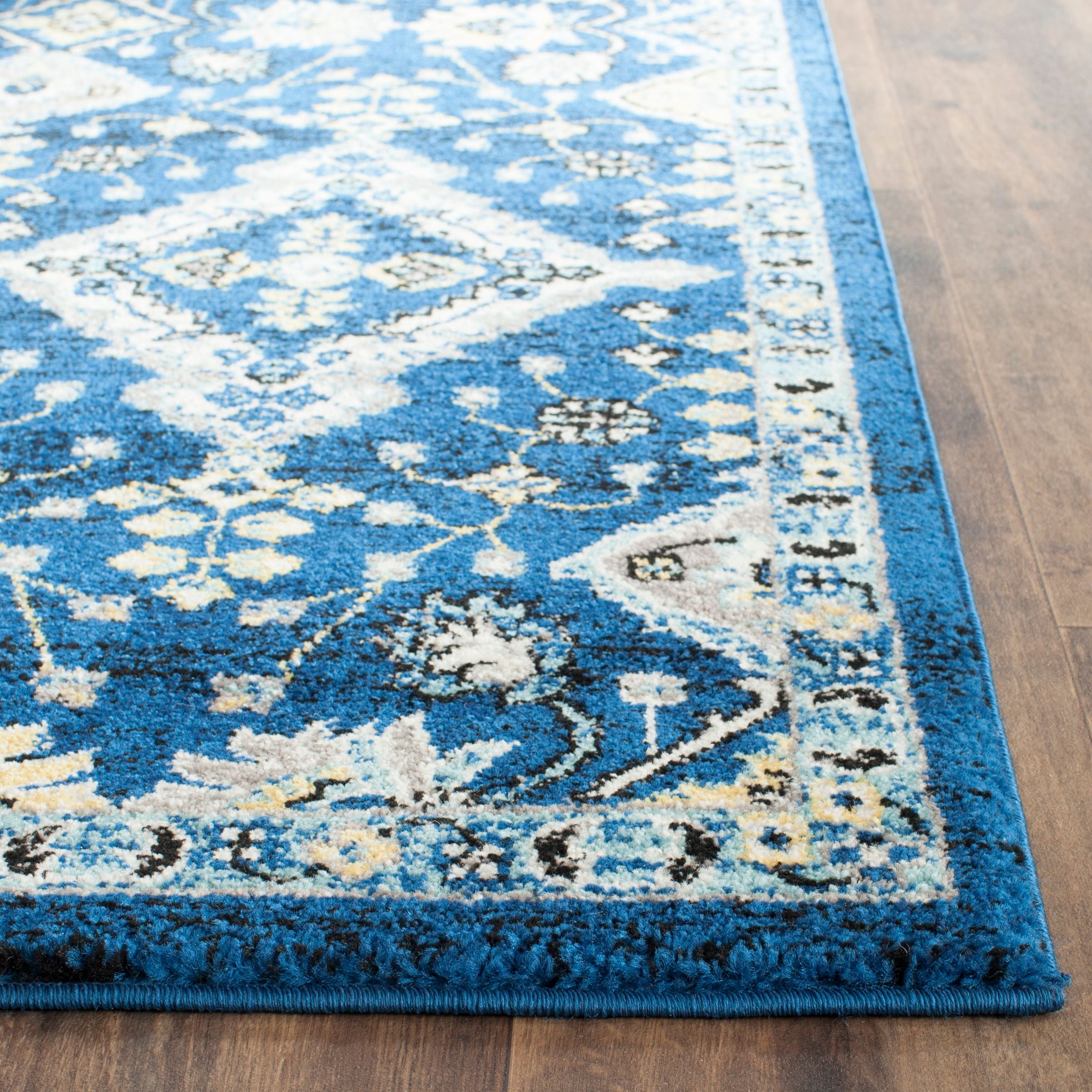 SAFAVIEH Evoke Stamen Bordered Area Rug, Royal/Ivory, 6'7" x 9'