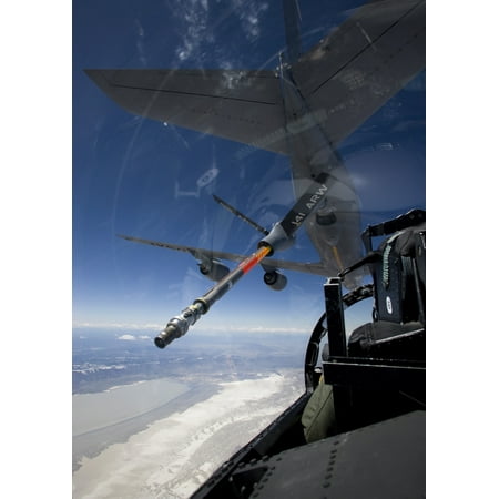 An F-15 Eagle pulls into pre-contact position behind a KC-135 Stratotanker during a training mission Poster