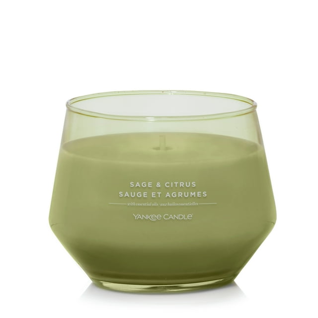 Yankee Candle sage and citrus scented candle in green glass jar with up to 50 hours burn time.