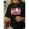 thumbnail image 1 of Women's Christmas Santa & Milk Tea Graphic T-Shirt - Festive Holiday Design with Santa Claus, Gifts, and Sweets, Casual Round Neck Short Sleeve Top, Black Polyester Tee for Summer, Holiday Apparel |, 1 of 6