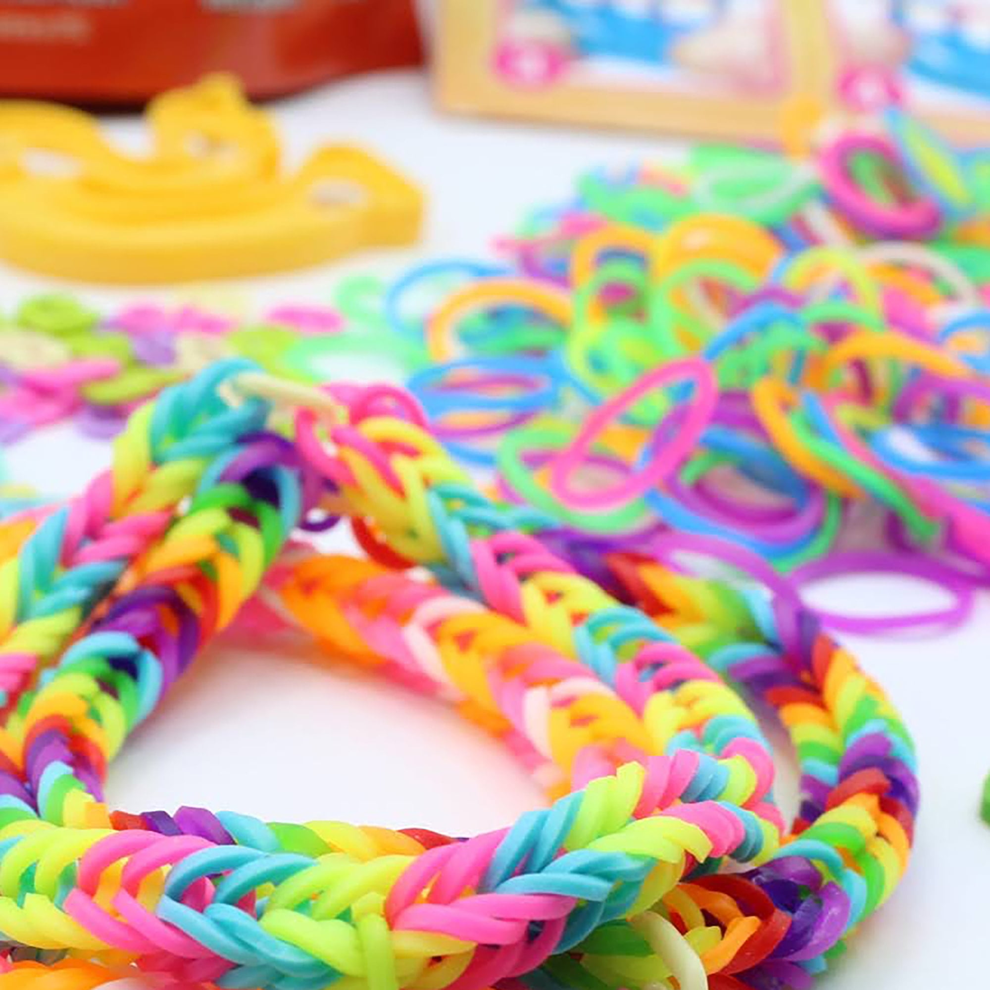 A bracelet in every Rainbow Loom rubber band color: white, maroon brown,  caramel, yellow, neon orange, … | Rainbow loom rubber bands, Rainbow loom  bands, Loom bands