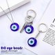 thumbnail image 4 of 20 piezas de dijes colgantes de ojo turco azul malvado CHAO llavero de vidrio amuleto para la suerte, 4 of 5