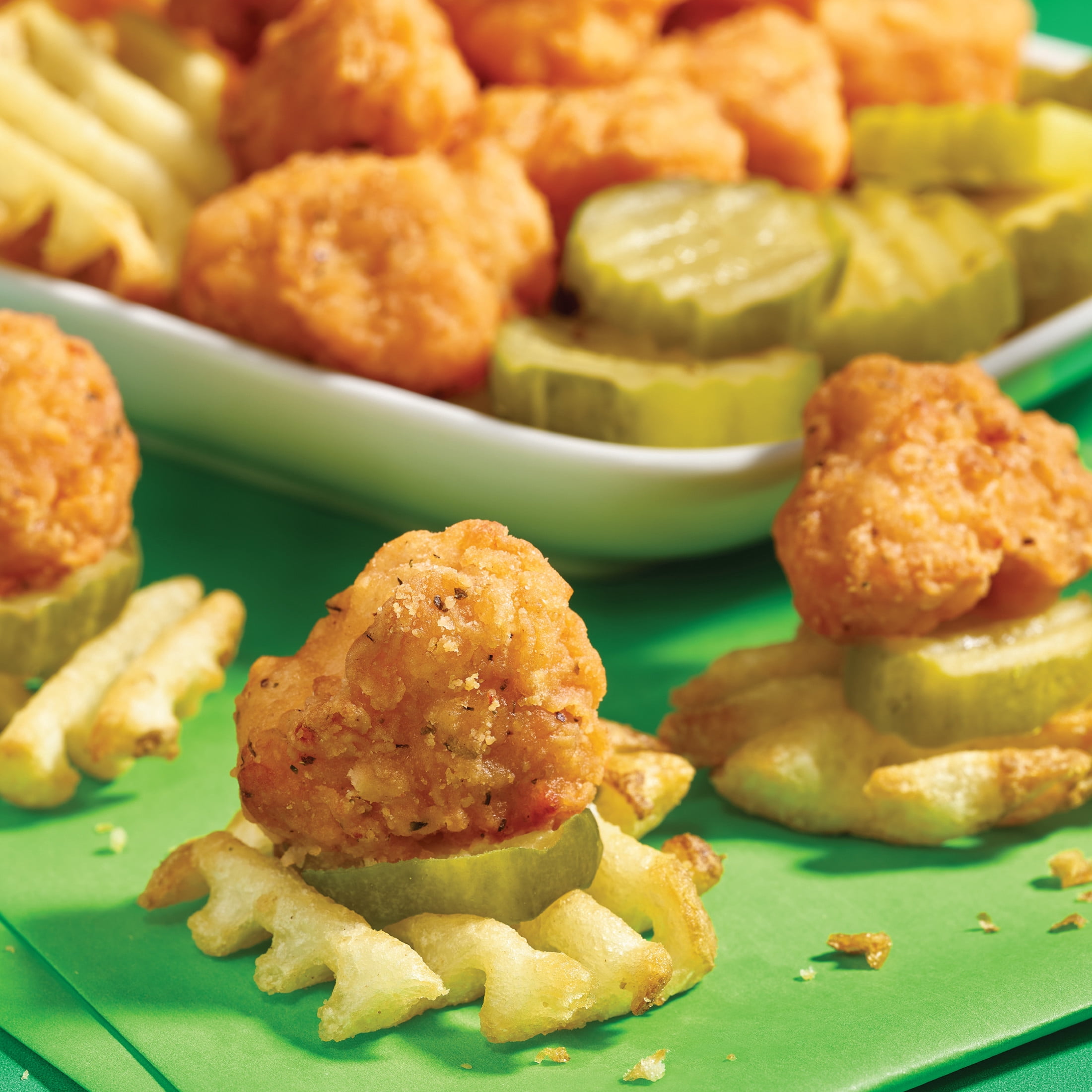 Pilgrim's Fully Cooked Dill Pickle Seasoned Popcorn Chicken Popcorn Shaped
Breaded Chicken Breast Patties with Rib Meat 1.5 lb, 11g of Protein, Serving Size 7 Pieces