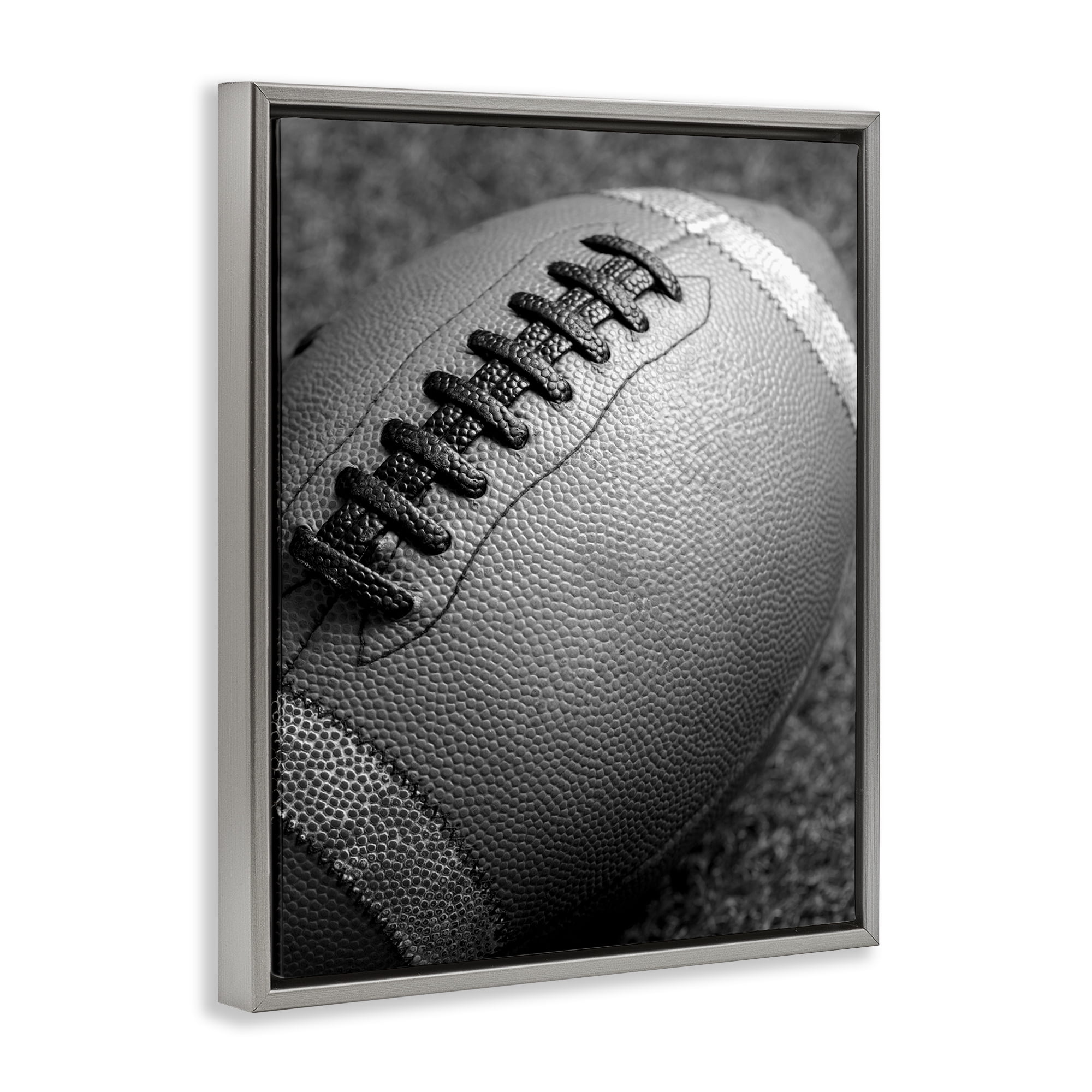 Stupell Industries Close Up Football Sports Photography Gray Floater Framed Canvas Art Print Wall Art, 25 x 31
