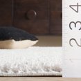 thumbnail image 5 of SAFAVIEH Penelope Braden Solid Shag Area Rug, Ivory, 5'3" x 7'6", 5 of 8