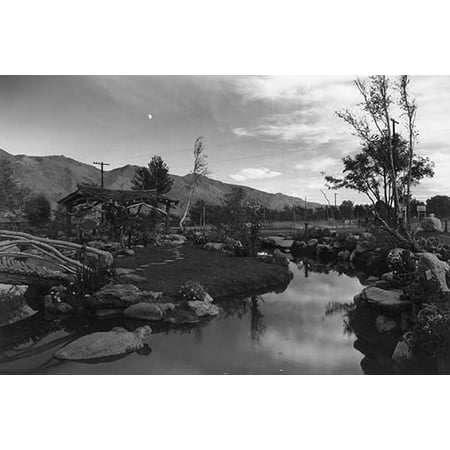 Japanese-style garden with pool at dusk with mountains in the background and moon  Ansel Easton Adams was an American photographer best known for his black-and-white photographs of the American
