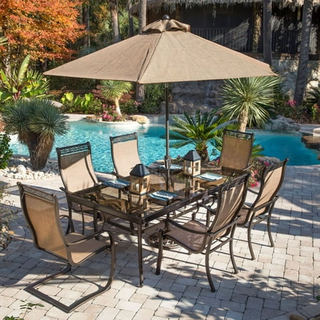 Hanover Outdoor Monaco 7-Piece Sling Dining Set with 42" x 84" Glass-Top Table, 4 Stationary Chairs and 2 Swivel Rockers, Cedar