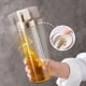 thumbnail image 3 of Botella dispensadora de Aceite de Oliva Cocina - Dispensador de aceite de vidrio con boquilla de acero inoxidable, 3 of 5