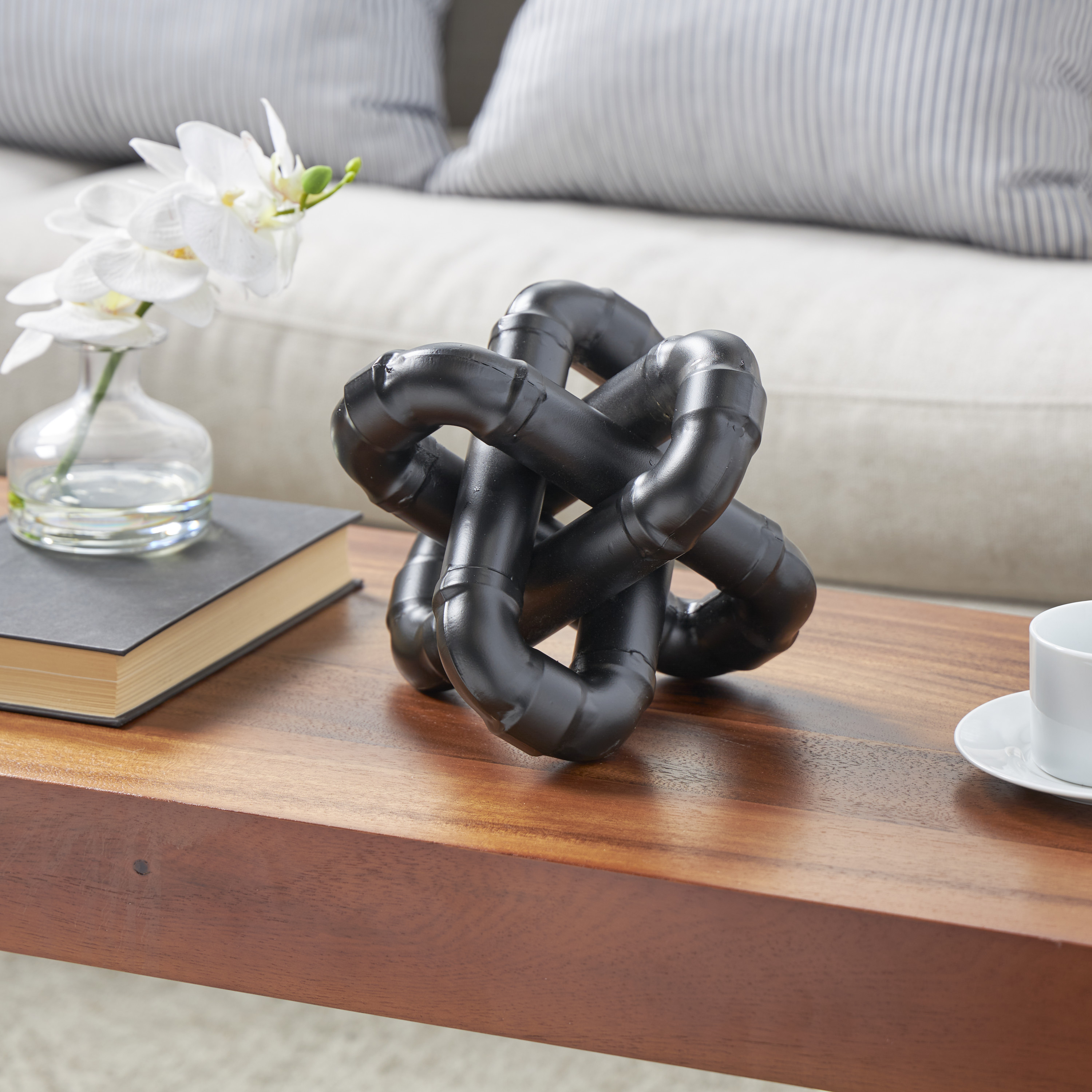 CosmoLiving by Cosmopolitan Black Metal Geometric Chain Link Jack Decorative Sculpture with Dimensional Ridges, 9" x 9" x 7"