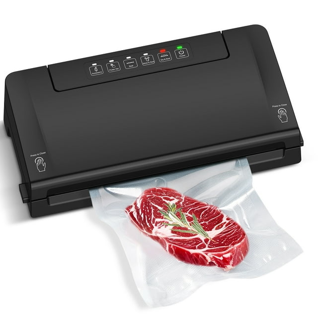 Mainstays black vacuum sealer sealing a bag with raw marbled steak and rosemary, featuring built-in cutter and roll storage
