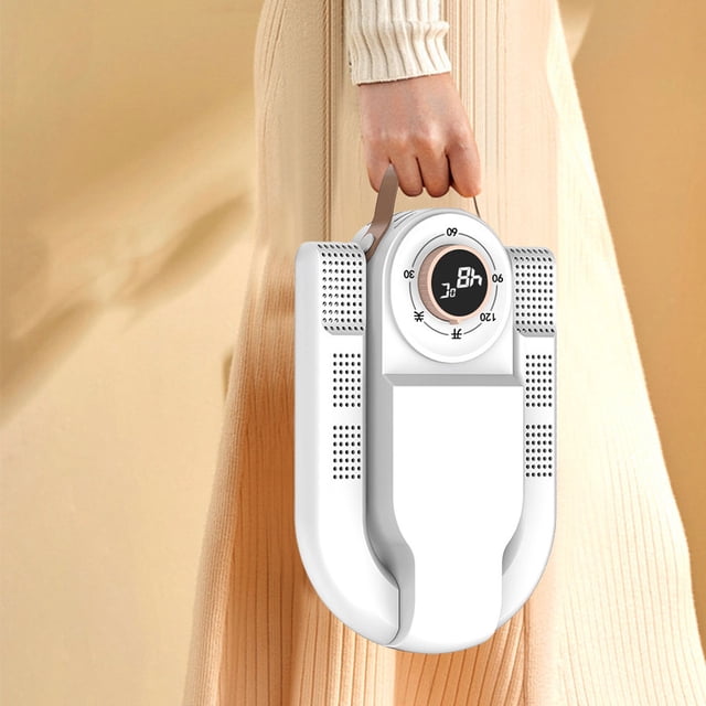 secador de zapatos plegable secador de zapatos eléctrico plegable de 220 v con temporizador para calcetines de zapatos para el hogar (actualización de ee. uu.) vista frontal centrada de la unidad plegada en blanco con asa, perilla circular con indicador de temporizador hasta 120 minutos, salidas de aire perforadas laterales y cuerpo compacto 278×180×81 mm; diseño plegable, material resistente a altas temperaturas y adecuado para secado y desodorización de varios tamaños de calzado.