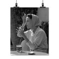 thumbnail image 2 of Print: Woman Wearing Headscarf Seated At Table With Drink, circa 1940, 2 of 4