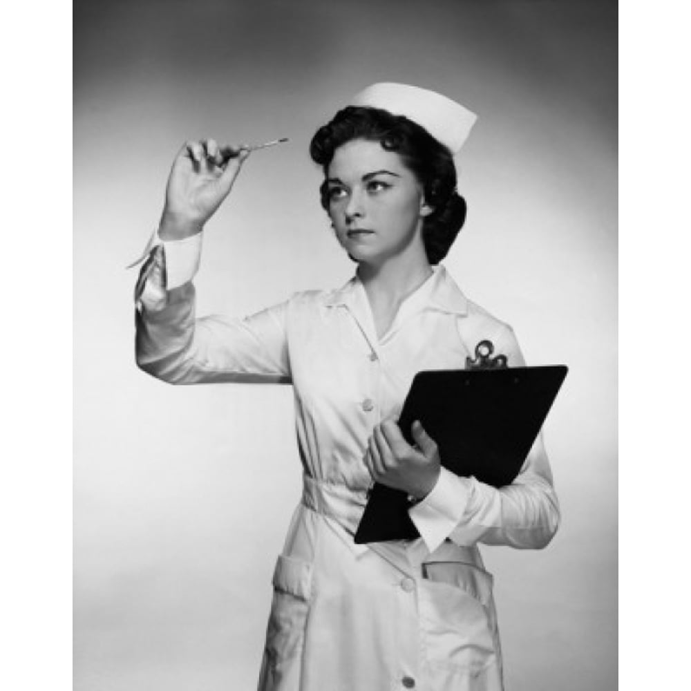 Closeup of a female nurse reading a thermometer and holding a