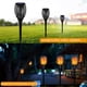 thumbnail image 4 of Lámpara solar de 96 LED para jardín, patio, decoración de paisajes, efecto de llamas danzantes, resistente al agua, para exteriores, 4 of 5