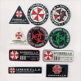 thumbnail image 2 of Adhesivo de aluminio 3D con logotipo de Umbrella Corporation para decoración de carrocería y maletero de Mercedes Benz, Chevrolet, JEEP, Seat y Mazda, 2 of 5