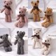 thumbnail image 1 of Muyoka Oso de peluche de juguete, oso encantador suave, juguete de peluche corto con bonito lazo, muñeco de oso de empuje decorativo, colgante de adorno de escritorio para el hogar Muyoka Hogar, 1 of 7