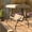 Tan, variant on Emma + Oliver 3-Seat Outdoor Steel Converting Patio Swing and Bed Canopy Hammock in Brown