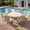 Sandshell Table-Sandshell Chairs, variant on VOXBIN Outdoor Patio Dining Set for 4 including 40 Inch Round Table with Umbrella Hole and Patio Swivel Chairs, Gray Table and Gray Chairs