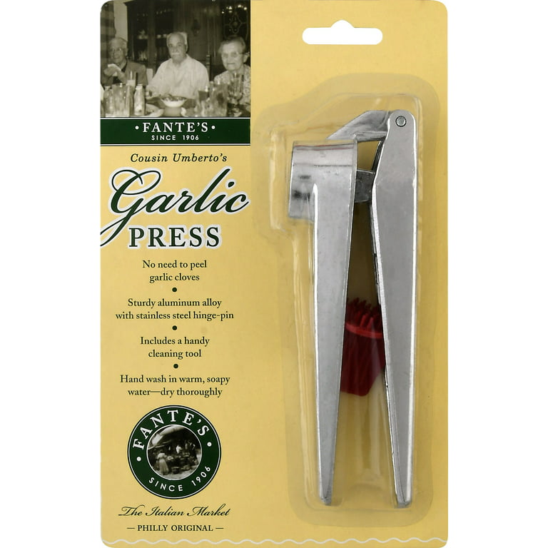 Old style cleaning tool, but still same great garlic press. Huge savings on  this. www.Pamperedchef.biz/carolc