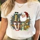 thumbnail image 3 of Camisetas estampadas de Papá Noel para mujer, camiseta de Navidad y Año Nuevo de los años 90, ropa femenina, Tops estampados, camiseta gráfica de dibujos animados a la moda para mujer, 3 of 5