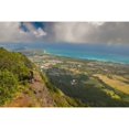 thumbnail image 2 of A man standing on the edge of a cliff on the Kuliouou Ridge Trial enjoys the view of Oahu's windward side and the town o, 2 of 4