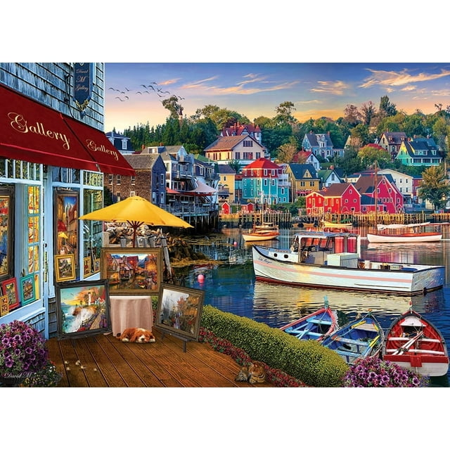Cobble Hill Jigsaw Puzzle - Harbor Gallery, 1000 Piece Puzzle showcasing a colorful seaside town with vibrant coastal buildings, docked boats, and an art gallery displaying paintings under a yellow umbrella. A relaxing activity, this puzzle features random-cut pieces, eco-friendly materials, and is made in North America.