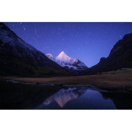 An Orionid meteor steaks over the Jampayang snow mountain in China Poster Print by Jeff DaiStocktrek
